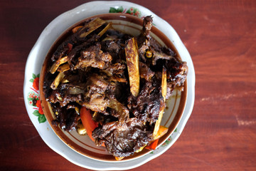 Tengkleng Kambing Pak manto, Solo, Central Java, Indonesia. Traditional Indonesian spicy food made from the bones of goat.