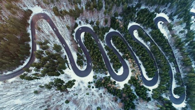Aerial view of Wavy Road In The Mountains. Aerial At Winter