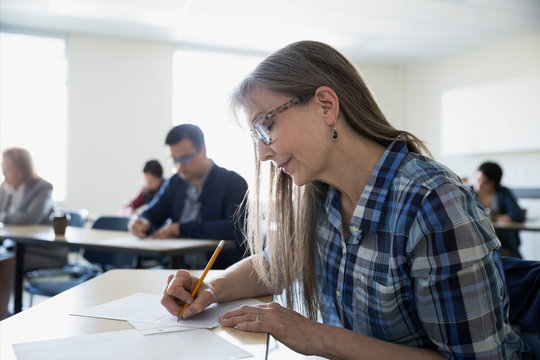 Adult Education Student Taking Test In Classroom