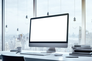 Close up of a blank computer screen standing on a white table in modern interior with big window with city view, mock up. 3D Rendering