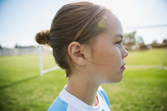 Close Up Profile Pensive Middle School Girl Soccer Player Looking Away