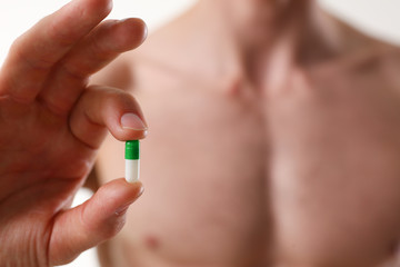 Athlete bodybuilder takes dope in the form of tablets form of pharma rapid progress in muscle...