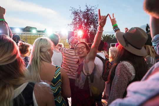 Portrait Enthusiastic Young Man Gesturing In Crowd At Summer Music Festival