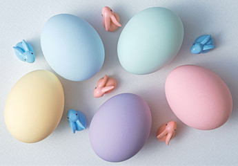 decorative easter eggs on a light wooden background. Easter-themed background with place for text
