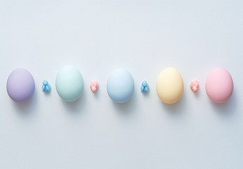 decorative easter eggs on a light wooden background. Easter-themed background with place for text