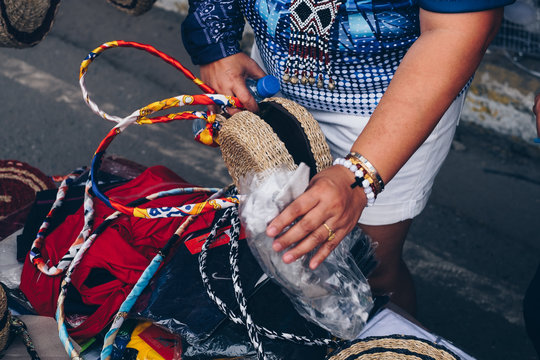 Unrecognizable woman holding handmade round Abaca shoulder bag. Selected focus. Copy space.
