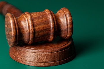 Wooden judges gavel on table close up