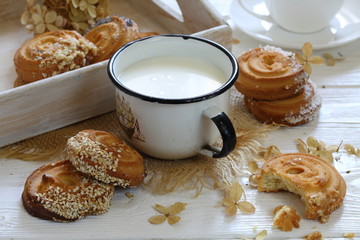 Still life with cookies and milk on a white background
