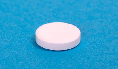 Pill isolated on blue background