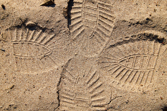 Footprint on the yellow sand for background or texture