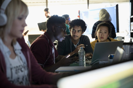 Hacker Team Working Hackathon At Laptop In Dark Office