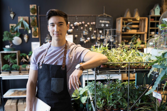 Portrait confident male shop owner in plant shop