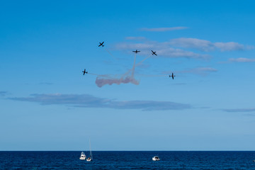 Fototapeta na wymiar formation planes over the water