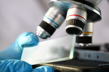 Head microscope on the background laboratory is a study human biology analyzes for non-compliance...