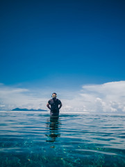 People in snorkeling mask dive underwater with tropical fishes in coral reef sea pool. Travel lifestyle, water sports, outdoor adventure, swimming family summer beach holiday with kids