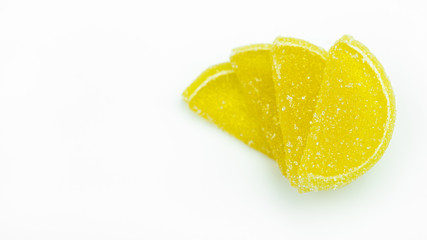 Marmalade, sweet, tasty lemon slices, bright, on a white background.