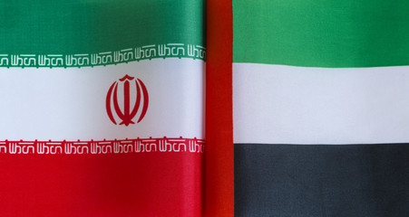 fragments of national flags of Iran and the United Arab Emirates in close-up