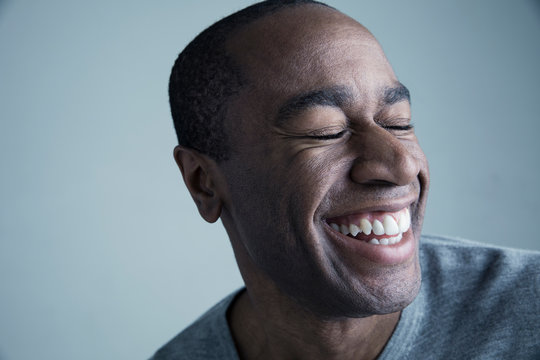 Portrait African American man smiling with eyes closed