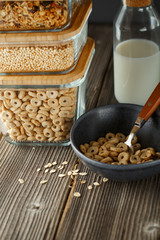 Breakfast cereal. Glass boxes with granola, cereal rings and Quinoa pops. Cereal Loops in a Bowl. Healthy Ready-to-eat breakfast for children. Quick breakfast cereals