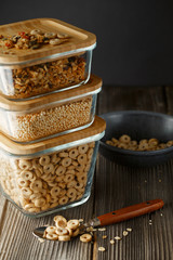 Breakfast cereal. Glass boxes with granola, cereal rings and Quinoa pops. Cereal Loops in a Bowl. Healthy Ready-to-eat breakfast for children. Quick breakfast cereals