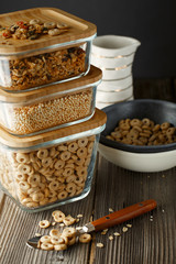 Breakfast cereal. Glass boxes with granola, cereal rings and Quinoa pops. Cereal Loops in a Bowl. Healthy Ready-to-eat breakfast for children. Quick breakfast cereals