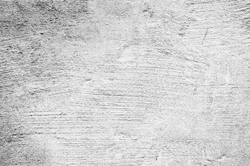 Texture of a concrete wall with cracks and scratches which can be used as a background