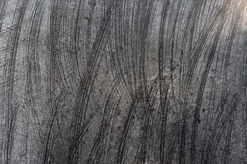 Texture of a concrete wall and scratches which can used for a background.