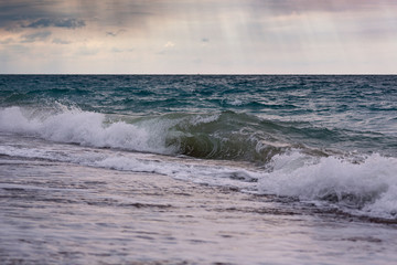 Seascape during storm and sunrise.