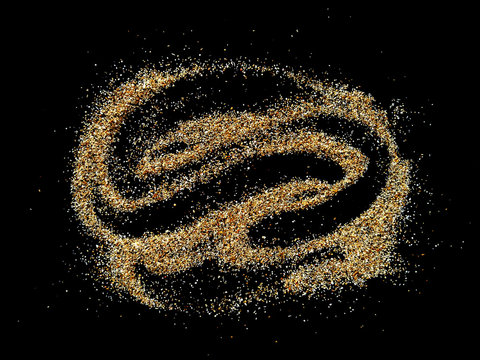 Abstract sand cloud and Golden sand explosion isolated on black background. Pile sand beach isolated on black background. Sand dunes isolated on black background.