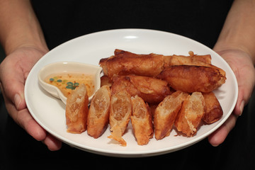 Deep fried spring roll as flour sheet wrap  fried vermicelli served with sweet sauce.