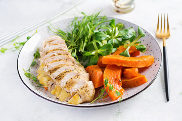 Chicken fillet with baked pumpkin and corn salad. Healthy food, ketogenic diet, diet lunch concept....