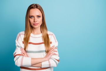 Fototapeta premium Photo of candid serious confident man with arms crossed looking at you standing near empty space isolated pastel color background