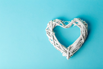 Love (Valentine's day) background or wedding background. White heart on a blue pastel background. Love concept