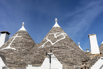 Fototapeta na wymiar Stone roof of Trulli House in Alberobello, Italy. The style of construction is specific to the Murge area of the Italian region of Apulia (in Italian Puglia). Made of limestone and keystone.