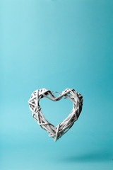 Love (Valentine's day) background or wedding background. White heart on a blue pastel background. Love concept