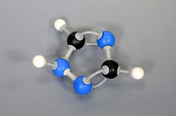 Molecule model of the antifungal 1 2 4 Triazole. Black is Carbon, blue is Nitrogen, and white is...