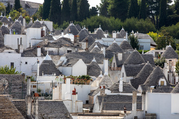 Tradtional white houses in Trulli village. Alberobello, Italy. 