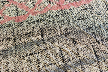 sample of old fabric with a purple-black shade