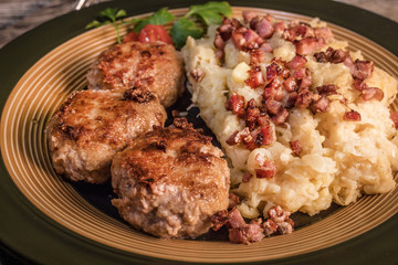 Minced meat cutlets with boiled sauerkraut.