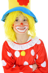 Portrait of a little child with costume and make-up as a clown isolated on white in studio