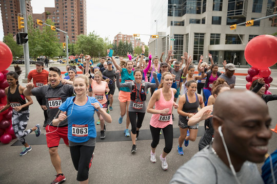 Marathon runners running on urban street