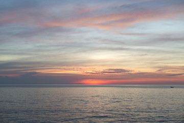 Sea pink sunset. Beautiful color clouds.