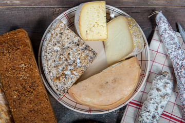 cheeses, sausage and Tomme de Savoie, Savoy, french Alps France.