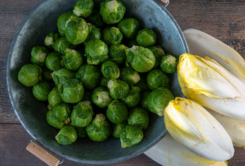 sprouts and endives on wooden background, Belgian vegetables