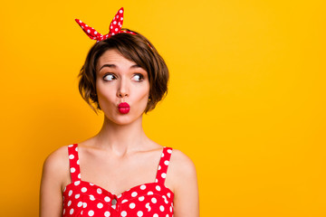 Close up photo of cute sweet lovely girl look copy space feel interested send air kiss wear...