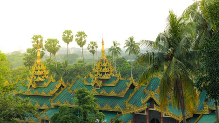Some beautiful roofs of temple complexes near the famous Shwedagon pagoda in Yangon, Myanmar - obrazy, fototapety, plakaty