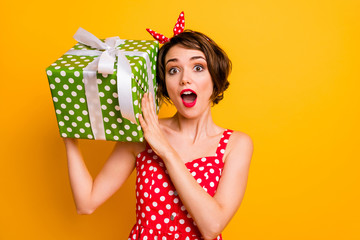 Portrait crazy astonished girl get big green dream gift box shake it want know what boyfriend give...