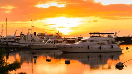 A beautiful sunset with yachts within the Manila bay, The Philippines