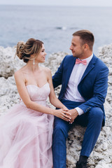 Loving couple on the seashore. Wedding. Newlyweds.