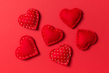Composition of textile red hearts on colorful background. Close up view. Top view of St. Valentine's day concept